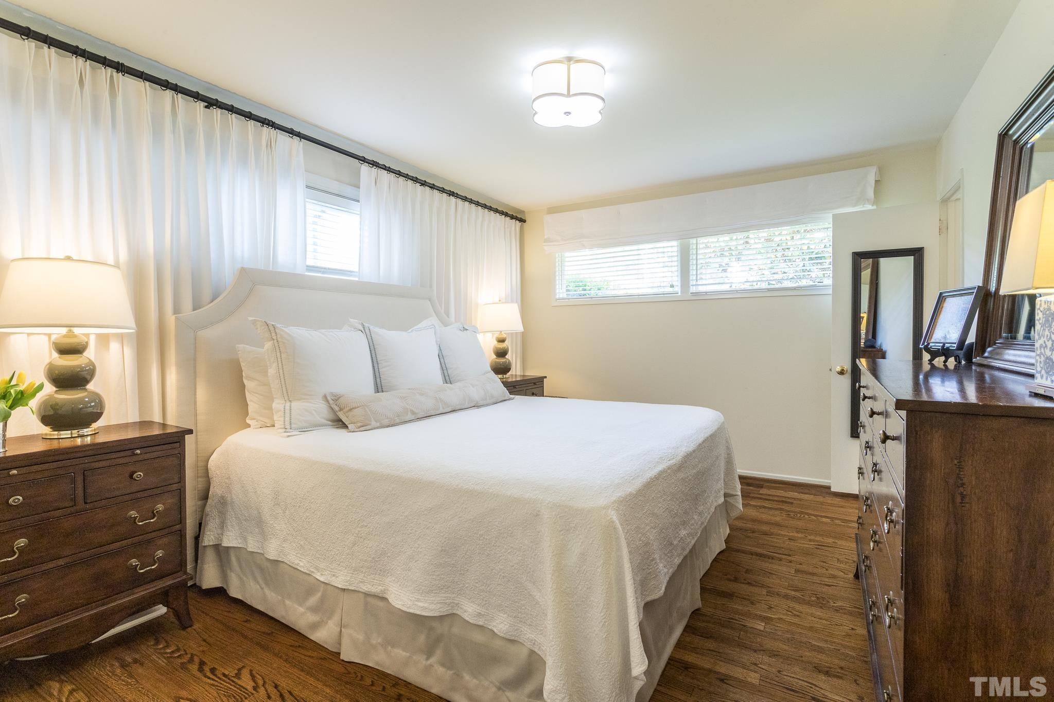 3431 Churchill Road Raleigh, NC 27607 - Photo 38 of 47 a bedroom with a bed and a window