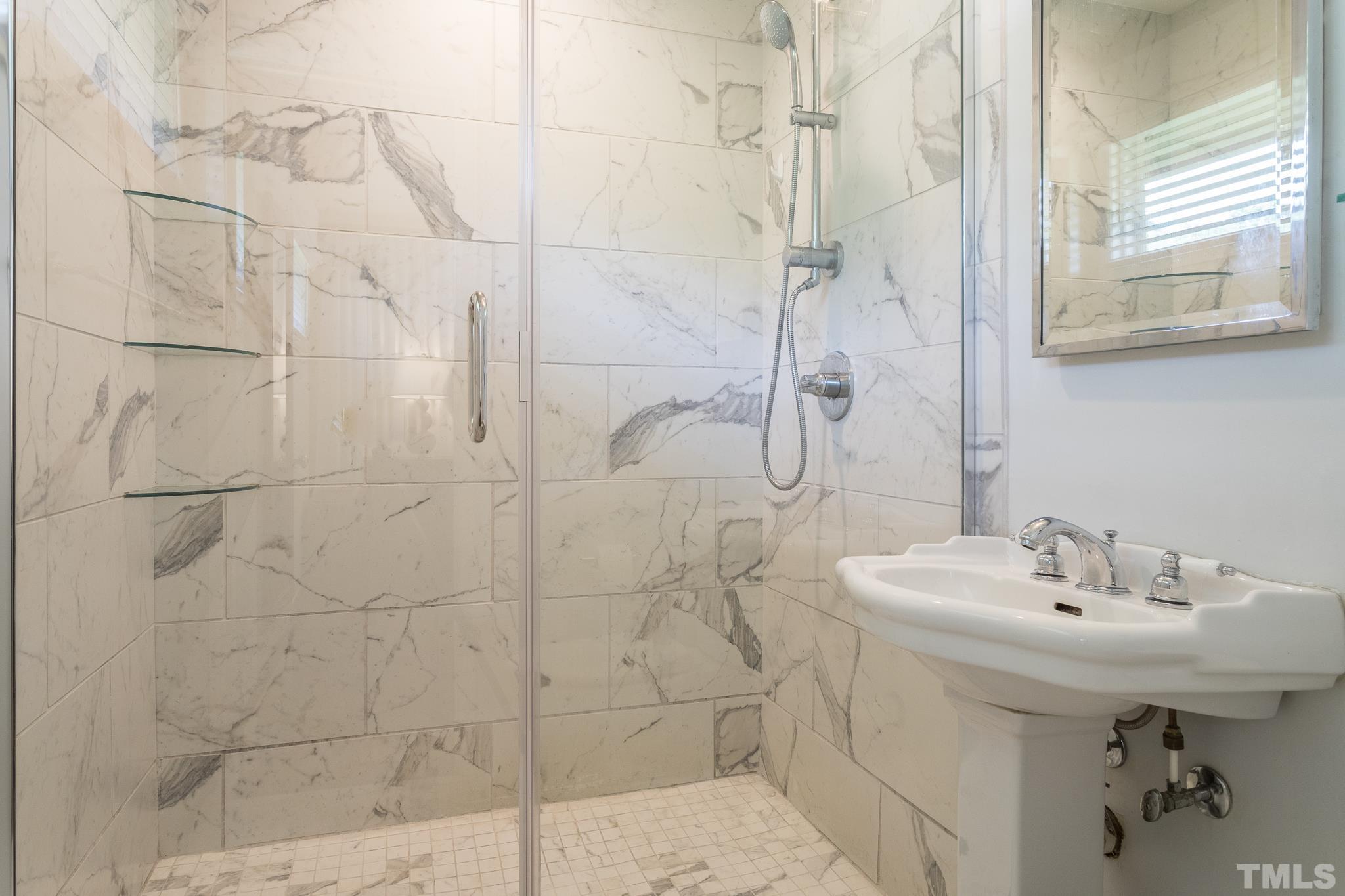 3431 Churchill Road Raleigh, NC 27607 - Photo 40 of 47 a bathroom with a sink shower and a mirror
