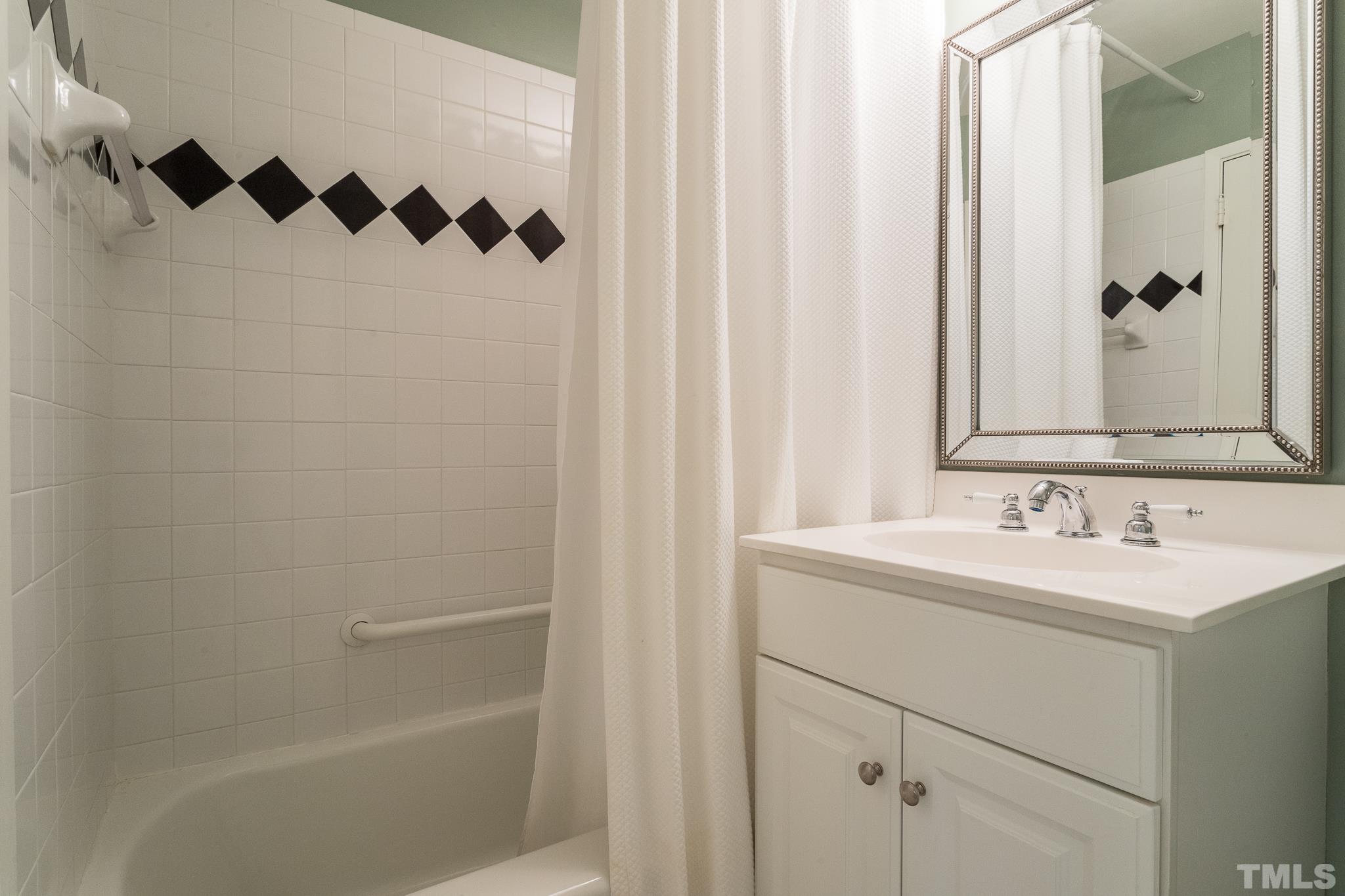 3431 Churchill Road Raleigh, NC 27607 - Photo 44 of 47 a bathroom with a sink and a mirror