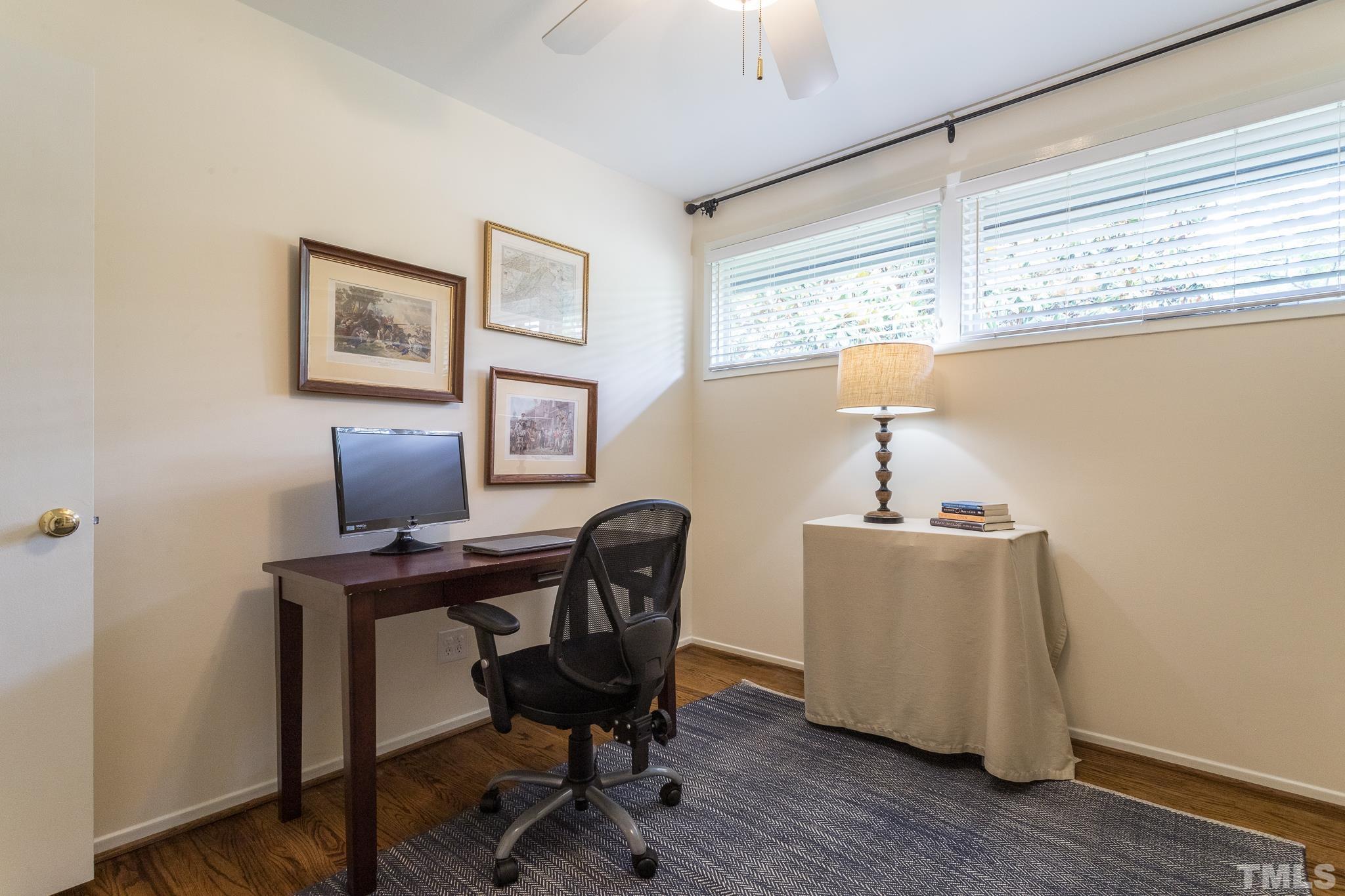 3431 Churchill Road Raleigh, NC 27607 - Photo 46 of 47 a workspace with furniture and a window