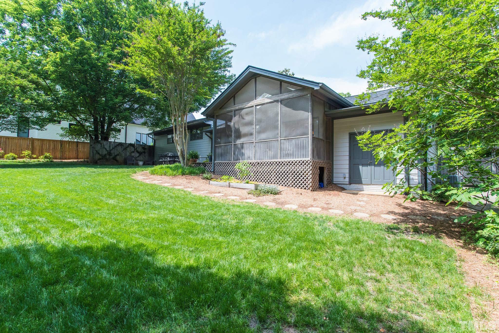 3431 Churchill Road Raleigh, NC 27607 - Photo 5 of 47 a view of a house with a yard