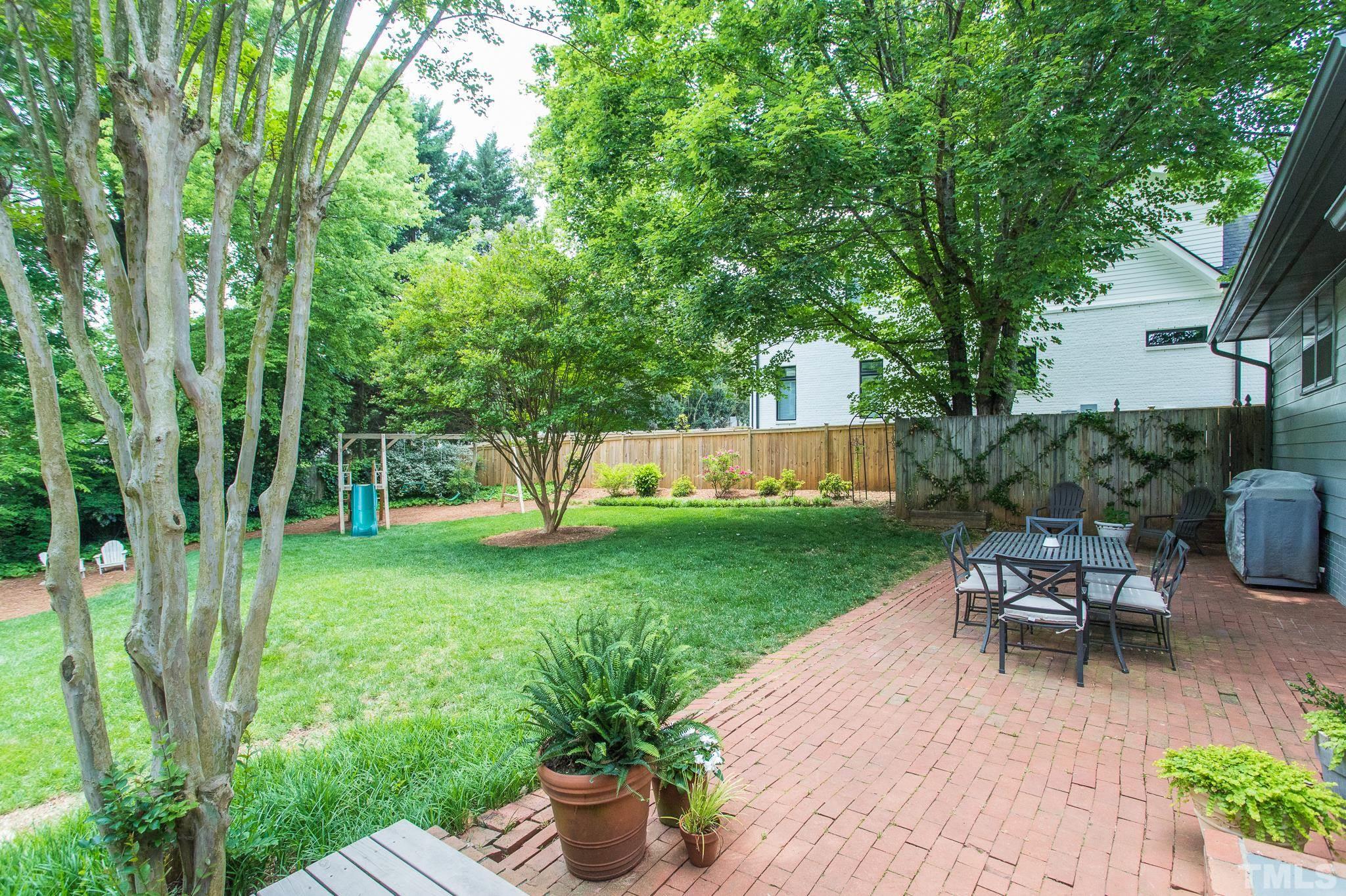 3431 Churchill Road Raleigh, NC 27607 - Photo 9 of 47 a view of backyard with seating and green space
