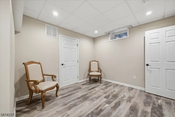 a view of a livingroom with furniture and a chair