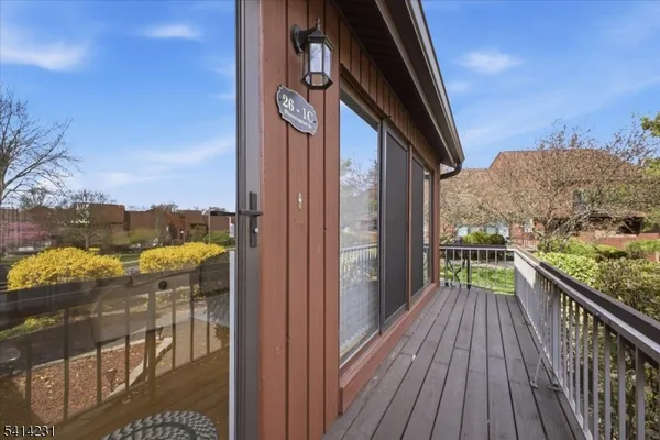 a view of balcony with furniture