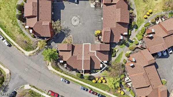 an aerial view of multiple houses with outdoor space