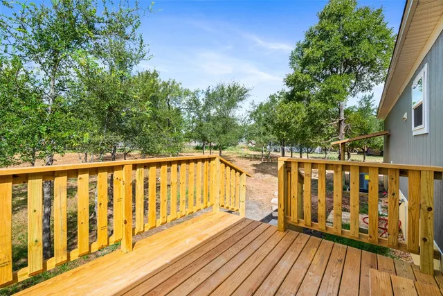a view of outdoor space with deck patio and outdoor seating
