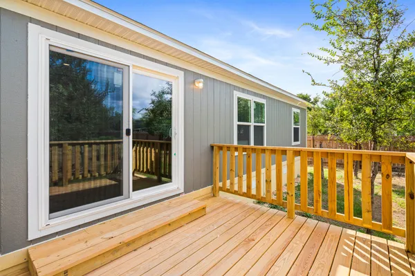 a view of outdoor space with porch and wooden floor