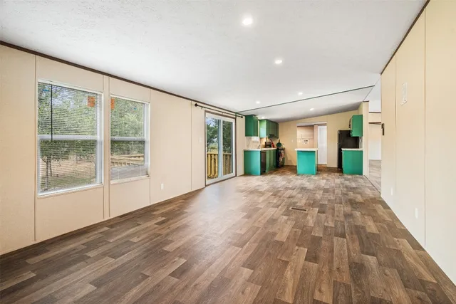 a kitchen with kitchen island a sink stove and refrigerator