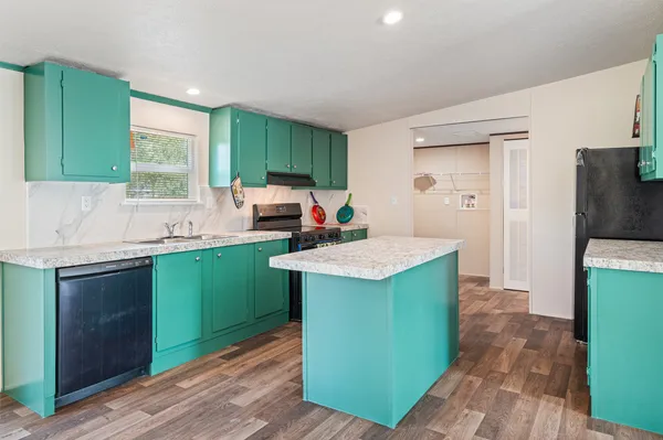 a kitchen with sink and cabinets