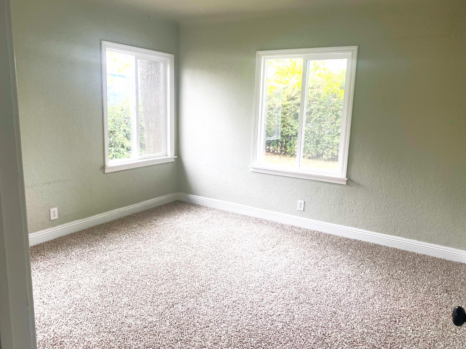 931 F Street Reedley, CA 93654 - Photo 7 of 11 an empty room with windows