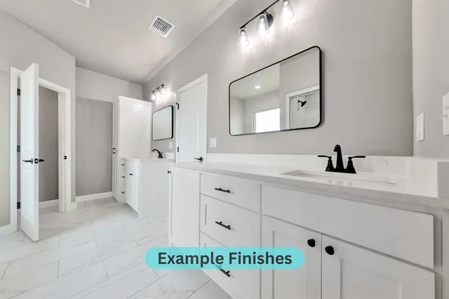 a bathroom with a sink a mirror and shower