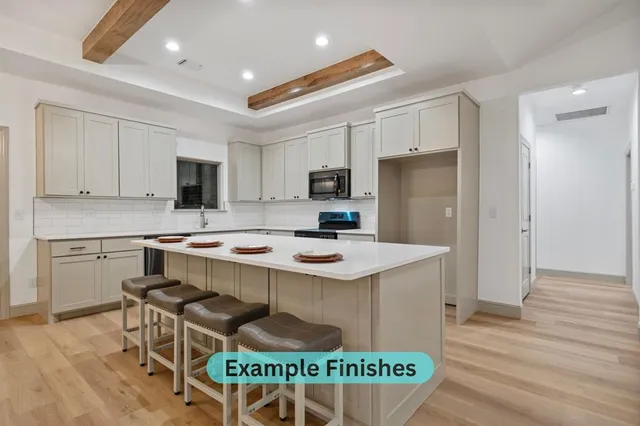 a kitchen that has a table and chairs in it