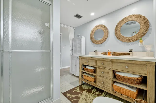 a bathroom with a mirror and a sink