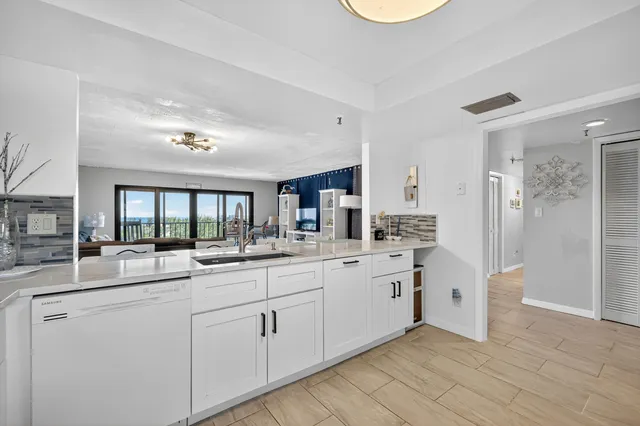 a kitchen with sink and cabinets