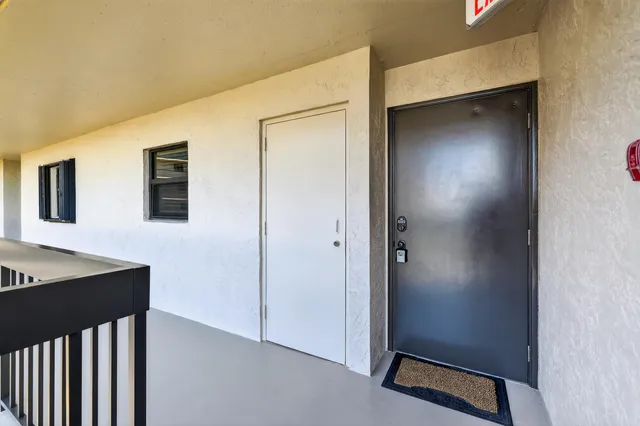a view of a hallway with bathroom