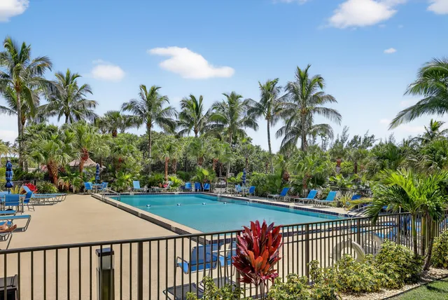 a view of street with a yard and a trees