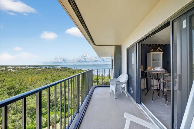a view of a balcony with chairs