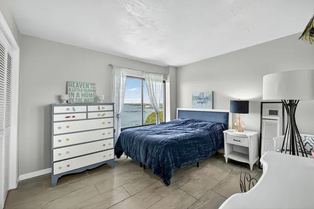 a bedroom with a bed and a dresser