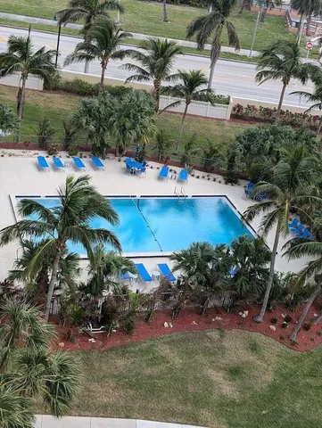 an aerial view of a house with a yard basket ball court and outdoor seating