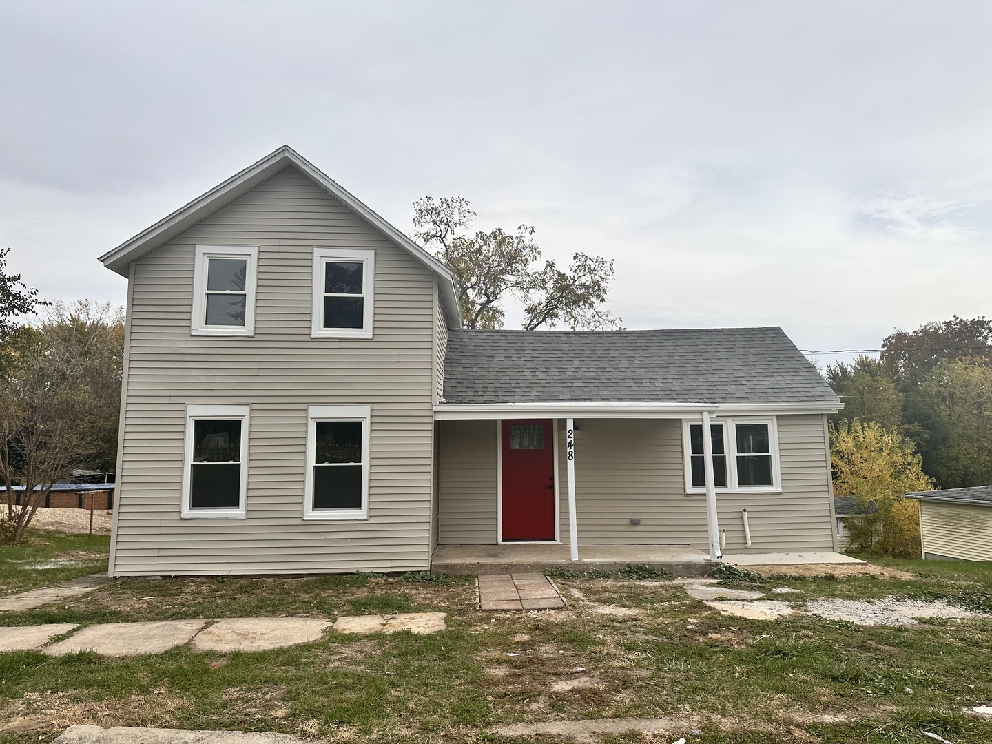 a front view of a house with a yard