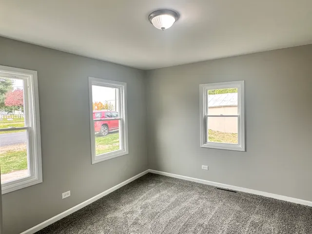an empty room with windows