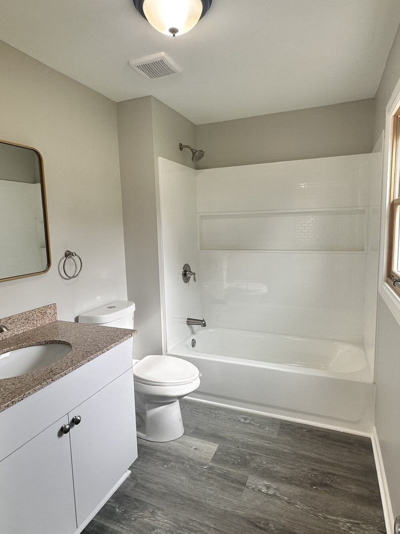 248 North State Street Franklin Grove, IL 61031 - Photo 17 of 26 a bathroom with a sink a toilet and shower