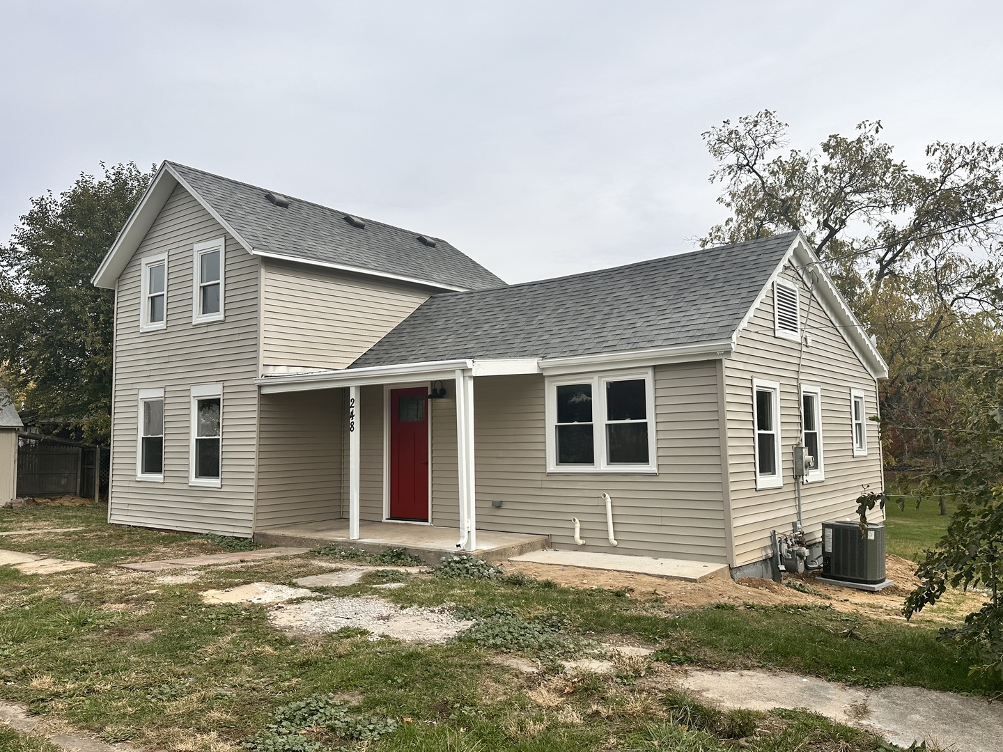248 North State Street Franklin Grove, IL 61031 - Photo 2 of 26 a front view of a house with a yard