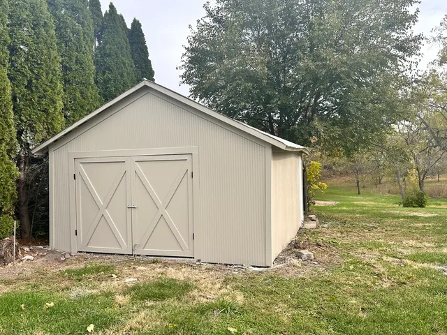 a view of a backyard of the house