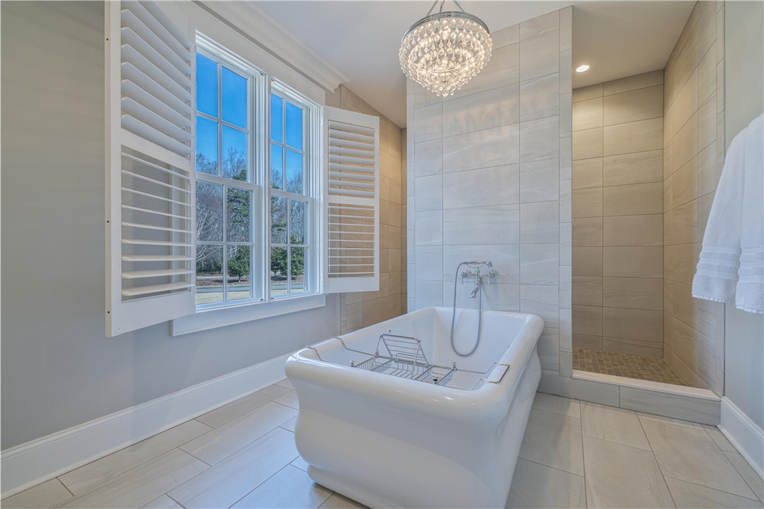301 Stonebridge Drive Clemson, SC 29631 - Photo 20 of 47 This serene bathroom offers a luxurious soaking tub and a spacious walk-in shower.
