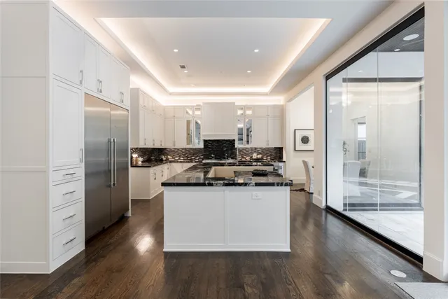 a view of a a dining room with furniture window and wooden floor