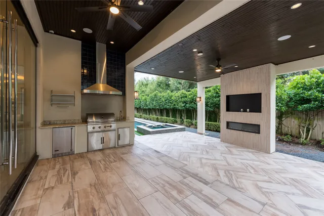 a spacious bedroom with bed and a fireplace