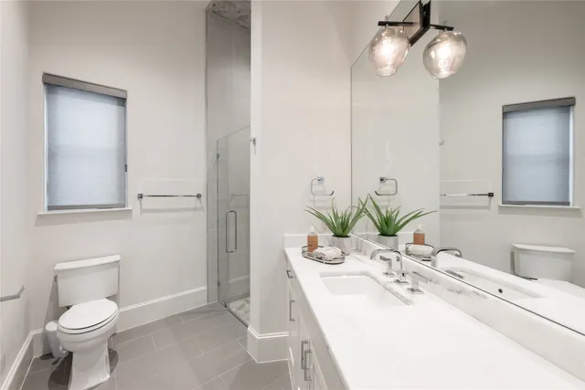 a large spacious bathroom with a double vanity sink a mirror and a bathtub
