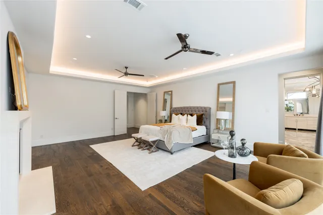 a view of walk in closet with wooden floor