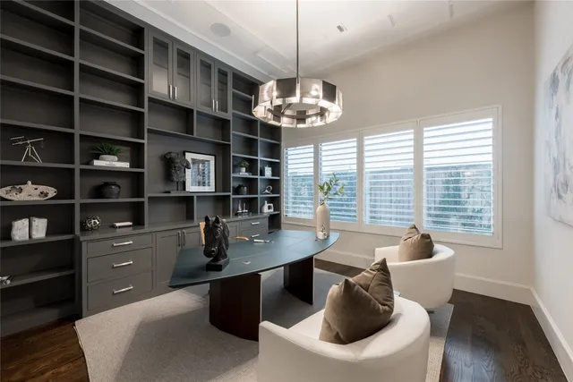 a living room with fireplace furniture and a flat screen tv