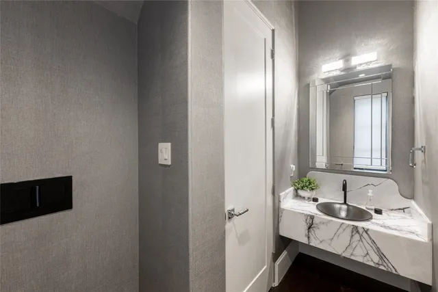 a kitchen with stainless steel appliances a sink and a refrigerator