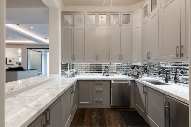 a kitchen with counter top space and living room