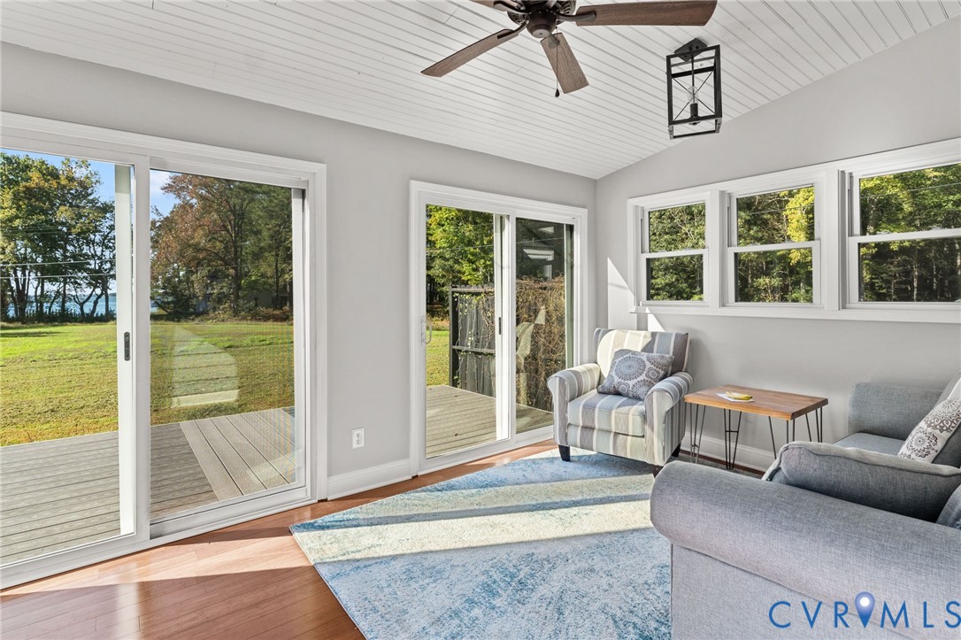 467 Blundon Road Reedville, VA 22539 - Photo 16 of 35 a living room with furniture and floor to ceiling windows