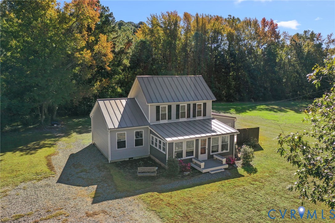467 Blundon Road Reedville, VA 22539 - Photo 32 of 35 a view of a house with pool and trees in the background