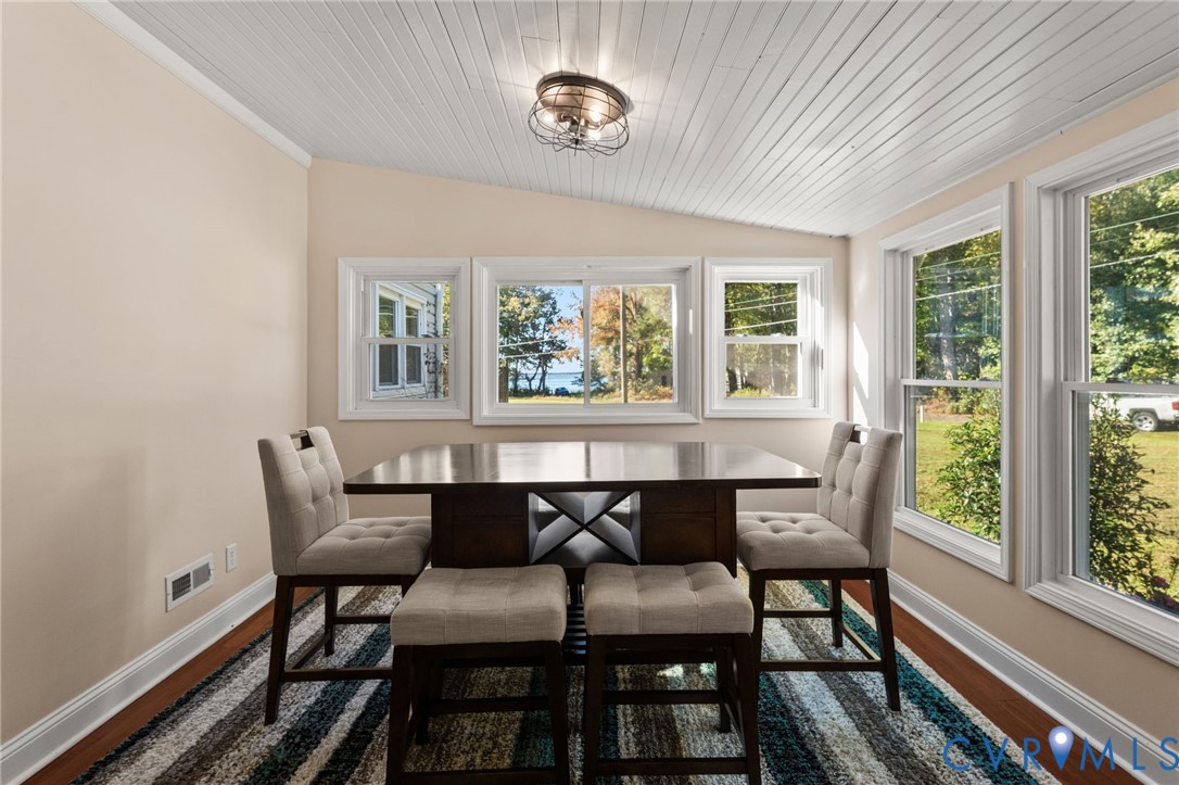 467 Blundon Road Reedville, VA 22539 - Photo 4 of 35 a view of a dining room with furniture a rug and wooden floor