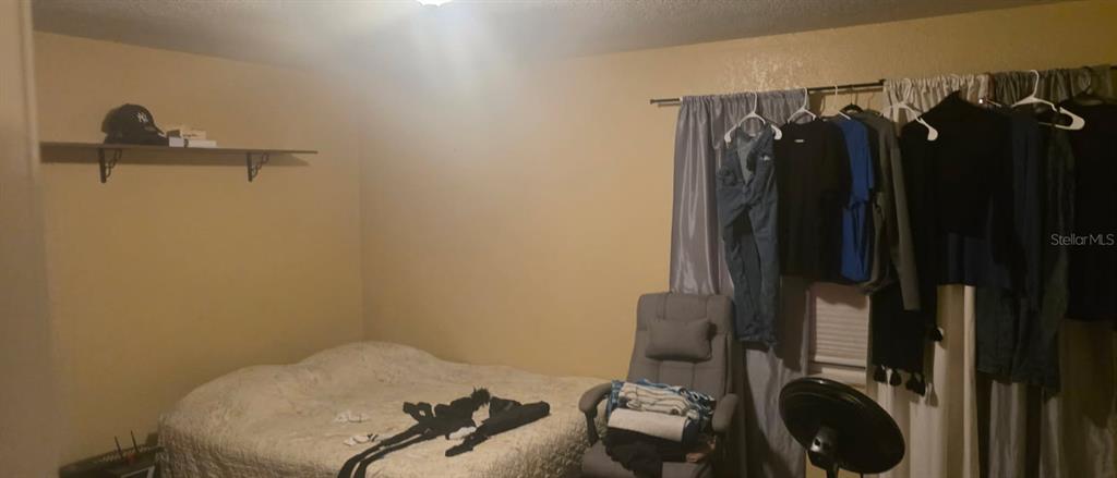 4906 Presidential Street Seffner, FL 33584 - Photo 11 of 23 a view of walk in closet with clothes and shoes