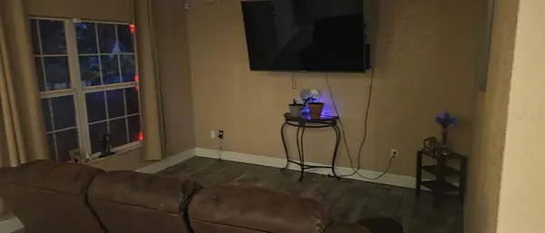 a living room with a couch and a flat screen tv