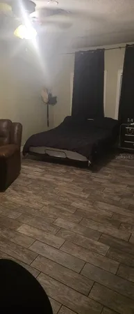 a bathroom with a toilet and shower