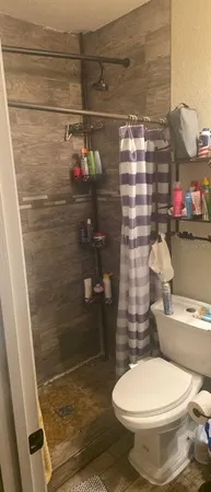 a utility room with closet and dryer