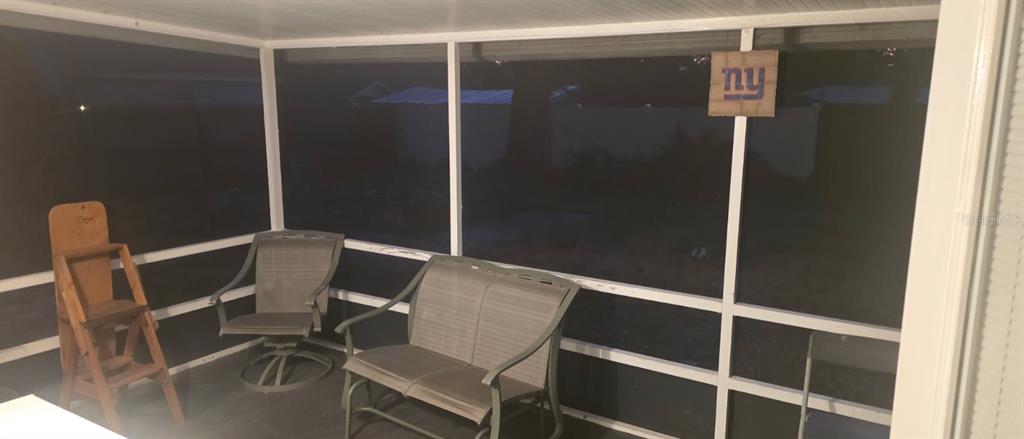 4906 Presidential Street Seffner, FL 33584 - Photo 23 of 23 a view of a room with table and chair