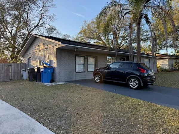 a car parked in front of a house
