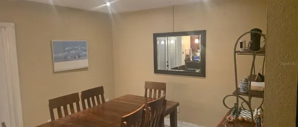 a view of a dining room with furniture