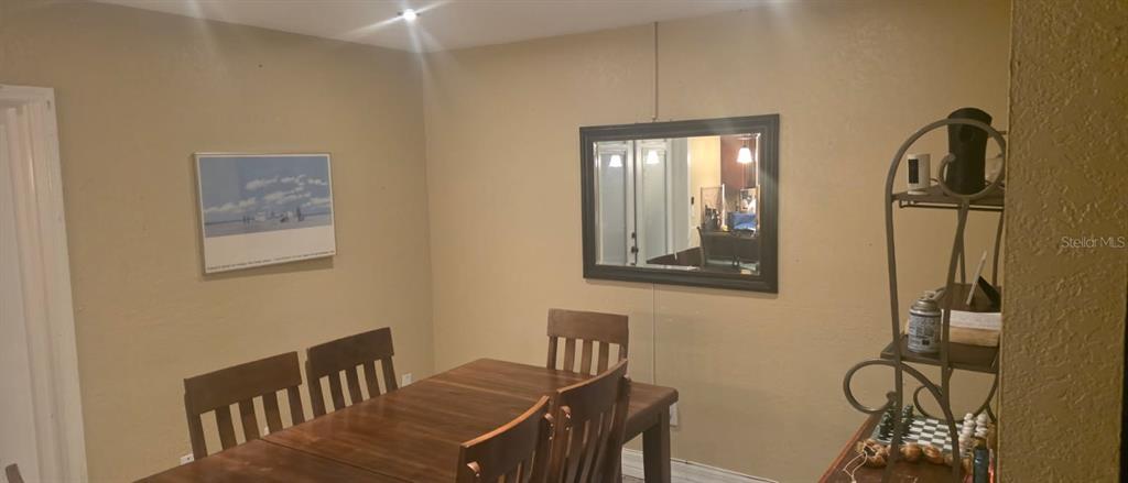4906 Presidential Street Seffner, FL 33584 - Photo 5 of 23 a view of a dining room with furniture