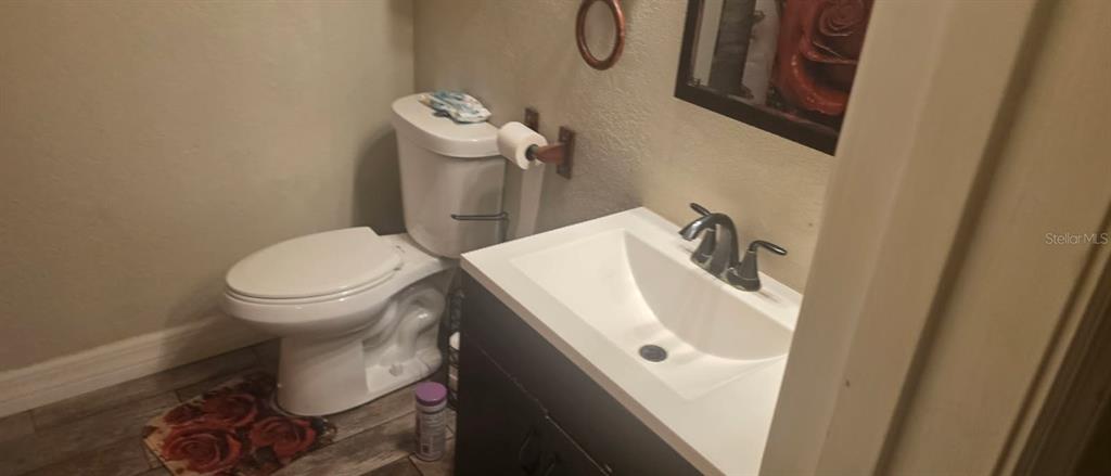 4906 Presidential Street Seffner, FL 33584 - Photo 8 of 23 a bathroom with a sink and a toilet