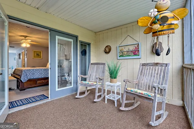 a bathroom with a granite countertop toilet sink and a mirror