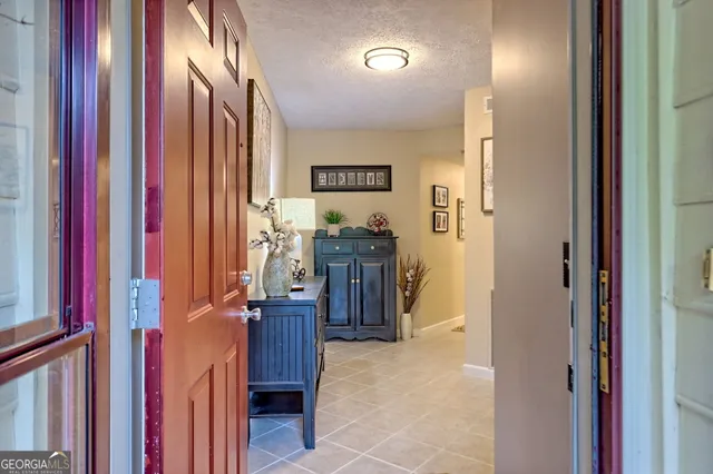 a kitchen with stainless steel appliances granite countertop a refrigerator a stove a sink and a microwave